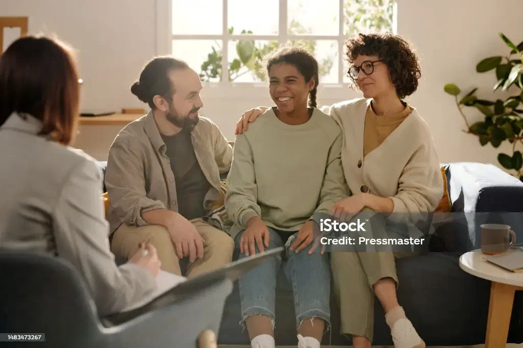 Foster parents talking with a social worker