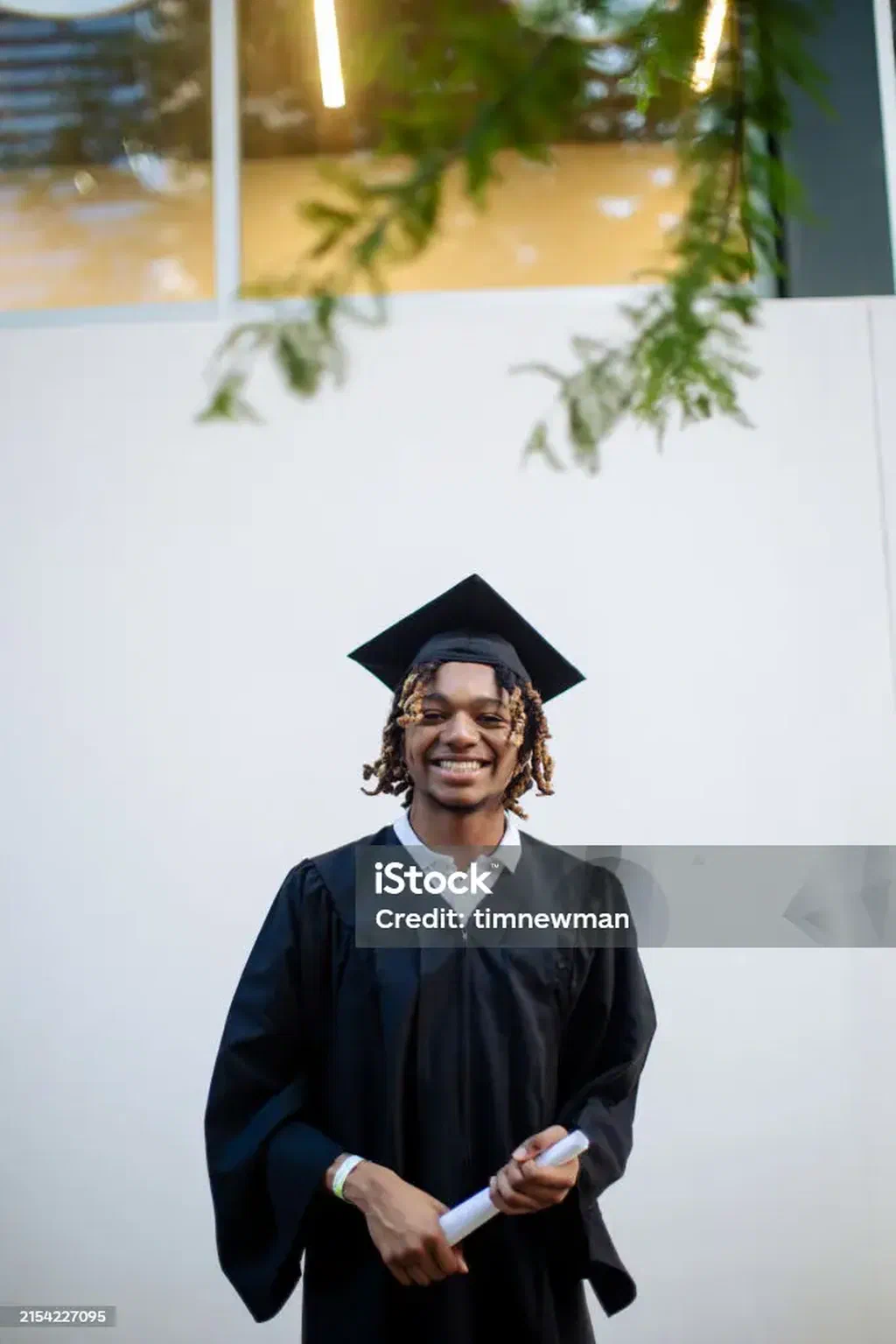 A smiling high school graduate