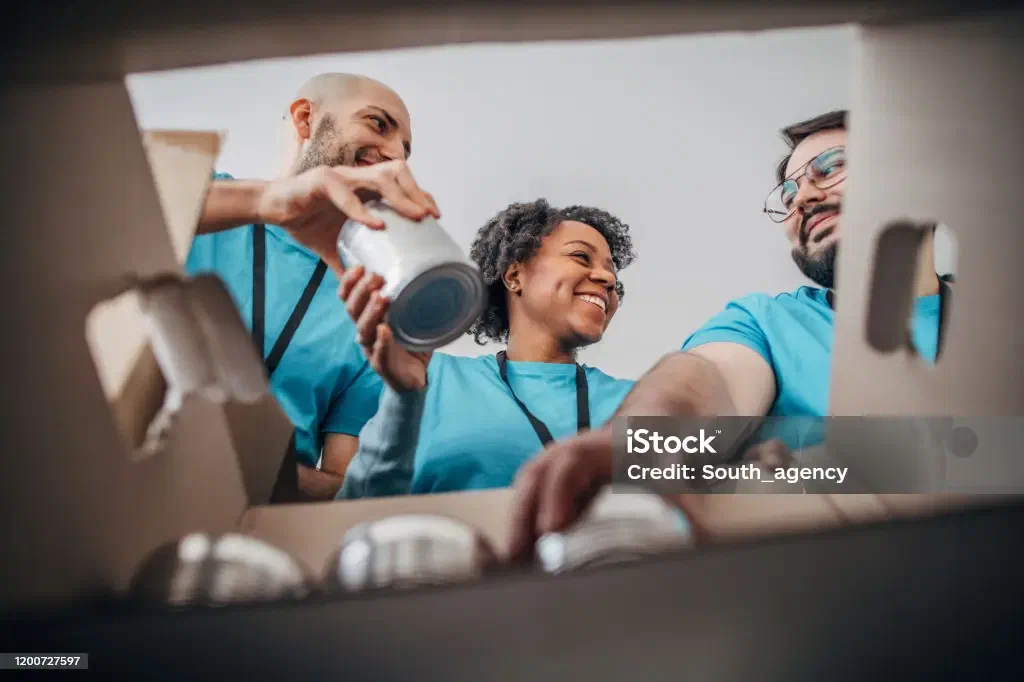 Volunteers packing donation boxes