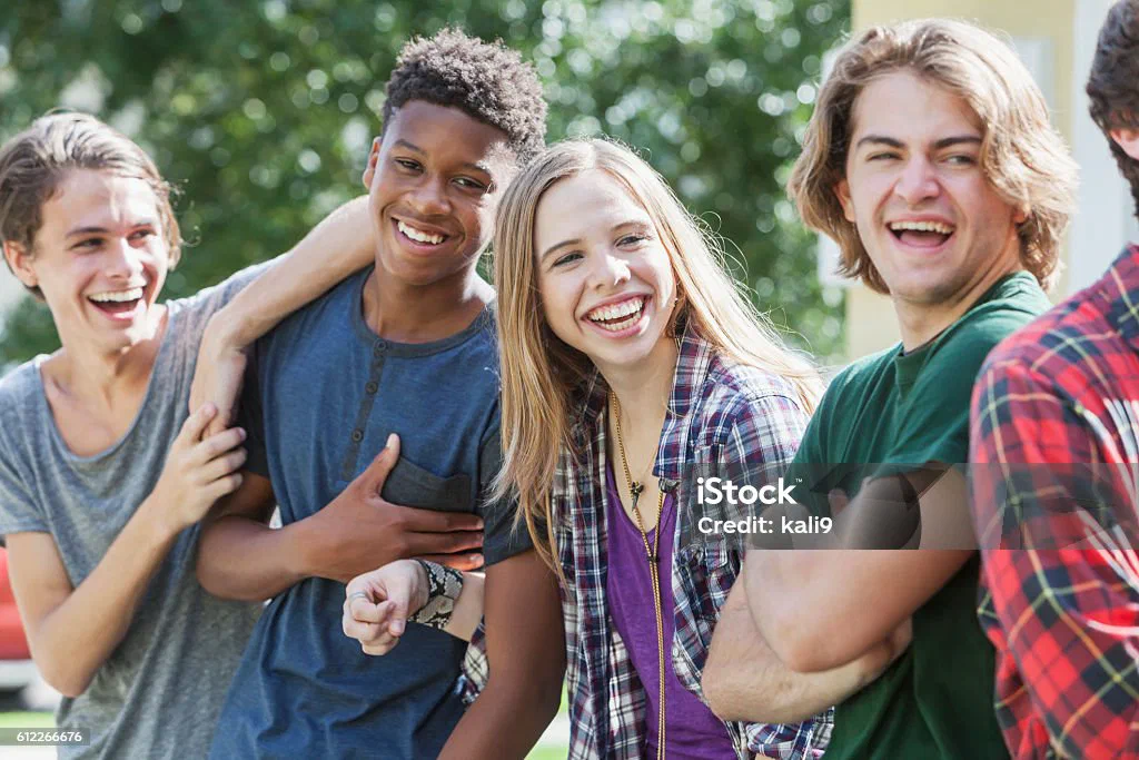 A counselor and a teenager talking across a table